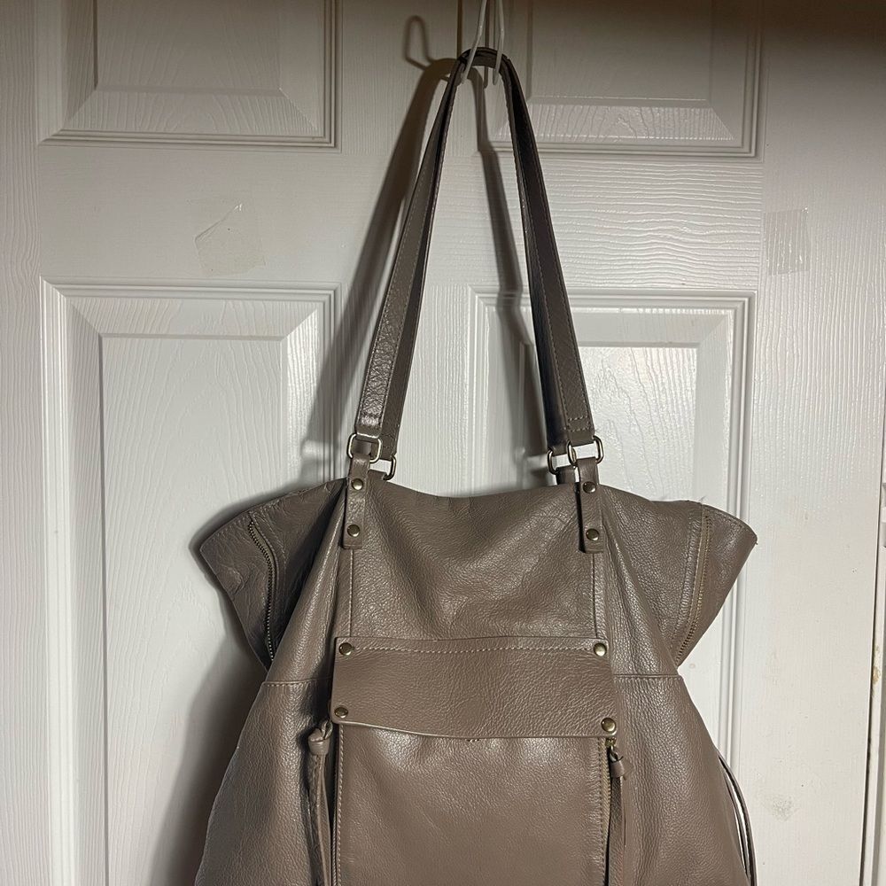 Kooba Taupe Leather Tote Bag with expandable side gold tone hardwares.